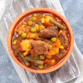 Delicious beef stew with potato, green beans, carrot, peas and corn, top view, square format Royalty Free Stock Photo
