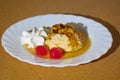 Delicious Beer Flan with sweet syrup and two cherrys and cream on a plate Royalty Free Stock Photo