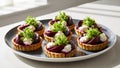 Delicious beet and goat cheese tartlets presented elegantly on a neutral plate Royalty Free Stock Photo