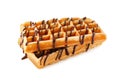 Delicious Belgian waffles with melted chocolate isolated on white Royalty Free Stock Photo