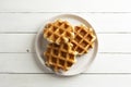 Delicious belgian waffles white wooden background, top view.