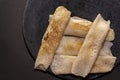 Delicious bengali sweet dessert called patisapta on a black background and selective focus