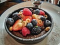 Delicious berry fruit chocolate tart focused on the berries in the middle. Royalty Free Stock Photo