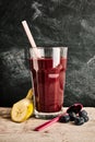 Delicious berry smoothie on marble surface