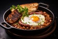 Delicious Big English Breakfast with Bacon, Eggs, Sausages, Baked Beans, and Toast