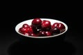 Delicious bigarreau cherry in black background