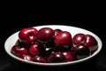 Delicious bigarreau cherry in black background