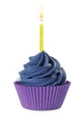 Delicious birthday cupcake with candle and blue cream isolated on white Royalty Free Stock Photo