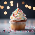 Delicious birthday cupcake on a table, closeup, light background
