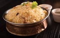 Delicious biryani in a round brass bowl. Royalty Free Stock Photo