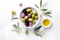 Delicious black, green and red olives with leaves in a bowl, isolated on white background, view from above. AI generated Royalty Free Stock Photo