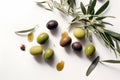 Delicious black, green and red olives with leaves isolated on white background, view from above. AI generated Royalty Free Stock Photo