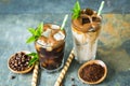 Delicious black and latte iced coffee in the glass