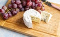delicious blue brie blue cheese with grapes