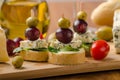 Delicious blue cheese with olives, grapes and salad Royalty Free Stock Photo