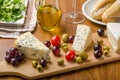 Delicious blue cheese with olives, grapes and salad Royalty Free Stock Photo