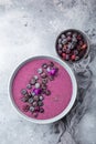 Delicious blueberry smoothie bowl with frozen berries