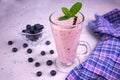 Delicious blueberry smoothie with mint and fresh berries.