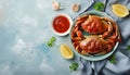 Delicious boiled crabs with sauce in bowl on blue tablecloth, top view. Space for text Royalty Free Stock Photo