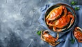 Delicious boiled crabs with sauce in bowl on blue tablecloth, top view. Space for text Royalty Free Stock Photo