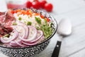 Delicious boiled rice with meat and vegetables in bowl on table, closeup Royalty Free Stock Photo