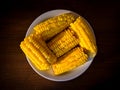 Delicious boiled sweet corn on white plate