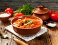 A delicious bowl of traditional Hungarian goulash, rich and hearty, garnished with fresh parsley Royalty Free Stock Photo