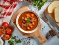A delicious bowl of traditional Hungarian goulash, rich and hearty, garnished with fresh parsley Royalty Free Stock Photo