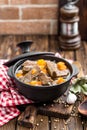 Delicious braised beef meat in broth with vegetables, goulash Royalty Free Stock Photo