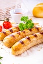 Delicious bratwurst with ketchup and fresh rolls