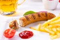 Delicious bratwurst with rolls and beer
