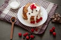 Delicious breackfast for family, pancackes with sour cream and berries, kitchen table decorated with raspberries, blueberries, Royalty Free Stock Photo