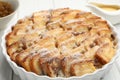 Delicious bread pudding with raisins and powdered sugar on white wooden table, closeup Royalty Free Stock Photo
