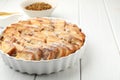 Delicious bread pudding with raisins and powdered sugar on white wooden table, closeup. Space for text Royalty Free Stock Photo