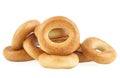 Delicious bread rings isolated on white background. Pile of fresh bagels