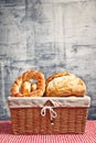 Delicious bread and rolls in wicker basket Royalty Free Stock Photo