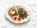 Delicious breakfast, brunch - toasts with butter, boiled eggs with red caviar, fresh salad on a light background, top view Royalty Free Stock Photo