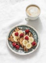 Delicious breakfast - cappuccino and peanut paste, banana toast on a light background, top view