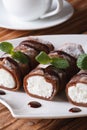 Delicious breakfast: chocolate crepes with ricotta vertical