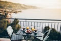 Delicious breakfast with coffee, pastry, and orange juice served on the balcony with sea view Royalty Free Stock Photo