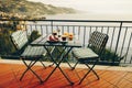 Delicious breakfast with coffee, pastry, and orange juice served on the balcony with sea view Royalty Free Stock Photo