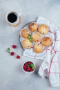 Delicious breakfast food concept. Coffee, raspberry muffins on concrete table. Top view, flat lay Royalty Free Stock Photo