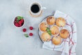 Delicious breakfast food concept. Coffee, raspberry muffins on concrete table. Top view, flat lay Royalty Free Stock Photo