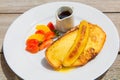 Delicious breakfast with french toasts with fried banana, honey Royalty Free Stock Photo