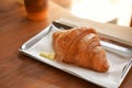 Delicious breakfast with fresh croissants and coffee served with butter Royalty Free Stock Photo
