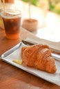 Delicious breakfast with fresh croissants and coffee served with butter Royalty Free Stock Photo