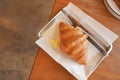 Delicious breakfast with fresh croissants and coffee served with butter Royalty Free Stock Photo