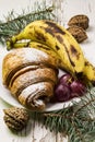 Delicious breakfast with fresh croissants and ripe berries on old wooden background, selective focus