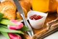 Delicious breakfast with fresh croissants on wooden table Royalty Free Stock Photo