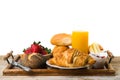 Delicious breakfast with fresh croissants on wooden table Royalty Free Stock Photo